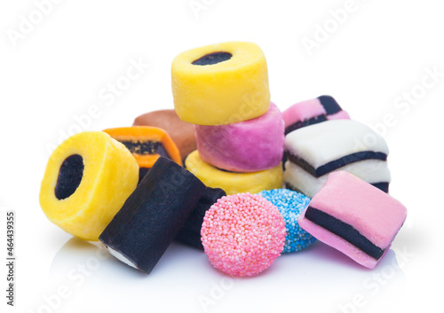 Photos Liquorice Allsorts Sweets mixed on white background.