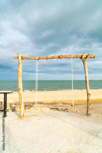wooden swing on the beach