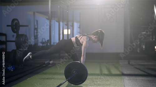 Photography Fitness woman train landmine single leg romanian dead lift with barbell