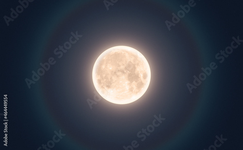 Full moon in night with halo. Horizontal option