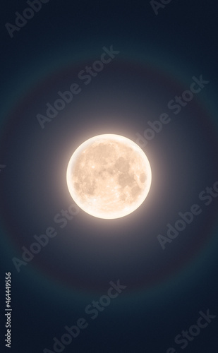 Full moon in night with halo. Vertical option