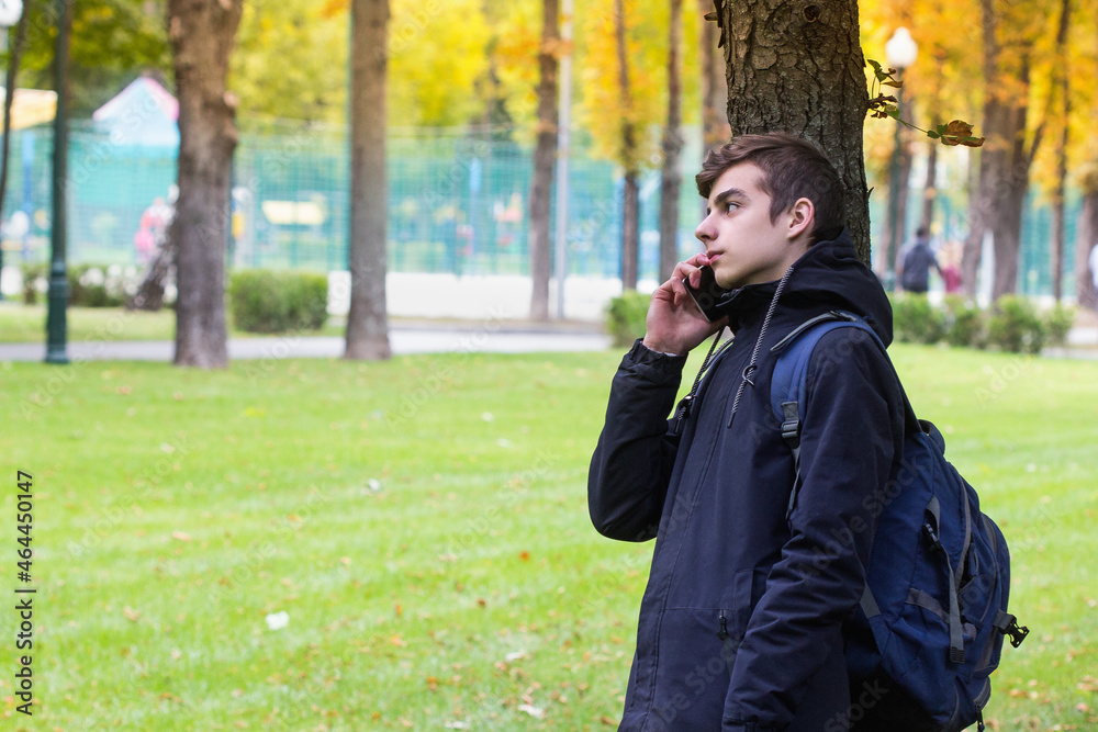 Portrait of Teenager boy with a smartphone talking phone Portrait of Teenager boy with a smartphone talking phone