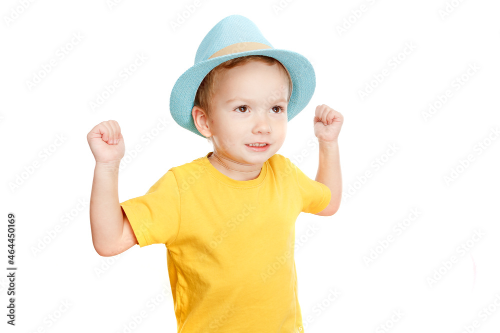 Little boy children in t-shirt and hat is dancing on white. Little boy children in t-shirt and hat is dancing on white.