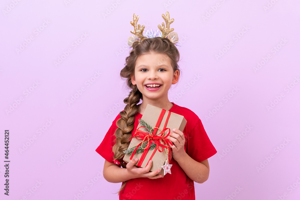 The little girl is very happy about the New Year's gift. The little girl is very happy about the New Year's gift.
