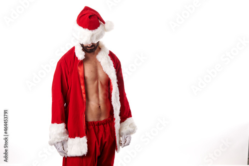 Santa Claus bodybuilder showing off his sexy athletic body on a white background