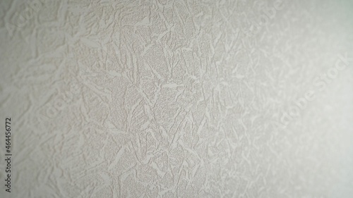 A room with elegant white wallpaper. White wallpaper in the room.