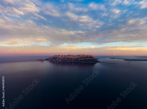 View from above, stunning aerial view of Tavolara Island during a dramatic sunset. Picture taken from Capo Ceraso, Sardinia, Italy. photo