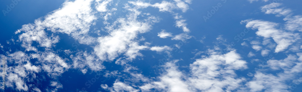 Obraz premium Panoramic photo of blurred sky. Blue sky background with cumulus clouds