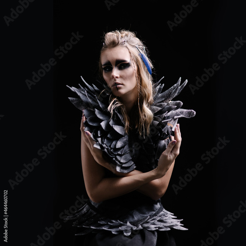 Canvastavla Beautiful woman in makeup and costume for halloween on a black background