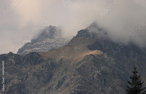 Gipfel im Nebel; Pizzo Malenco und Sassa d' Entova über dem Valmalenco (Bernina-Alpen) photo