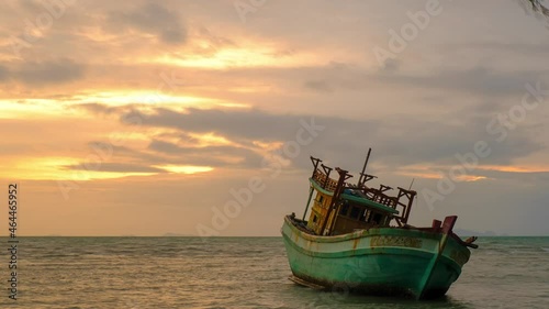 4k timelapse clouds move over wreck ship on the beach, twilight sky sunset landsacape , at Nathon beach , koh samui ,Suratthani thailand photo