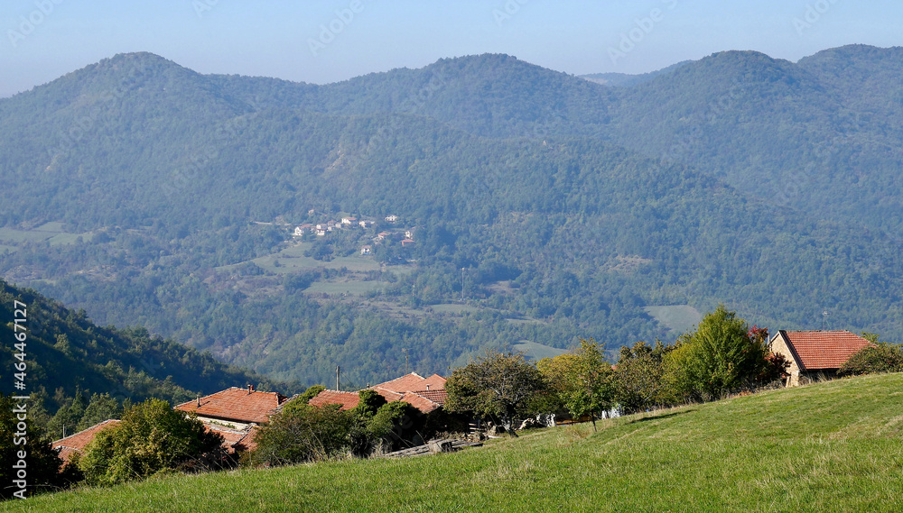 A typical traditional landscape of the Val Borbera with a small rural village in the hills