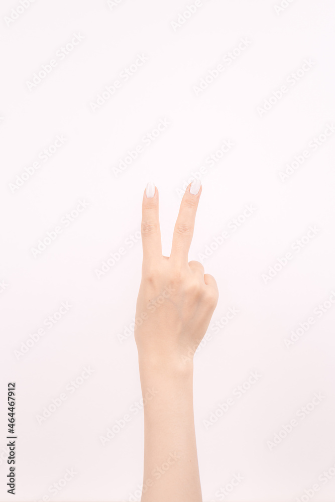 hand showing number two In front of the white background hand showing number two In front of the white background