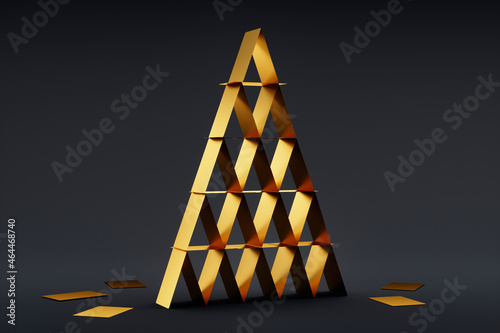 Foto House of  golden cards on dark background