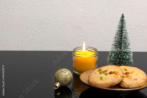 Christmas decorations with a plate of orange peel cookies.