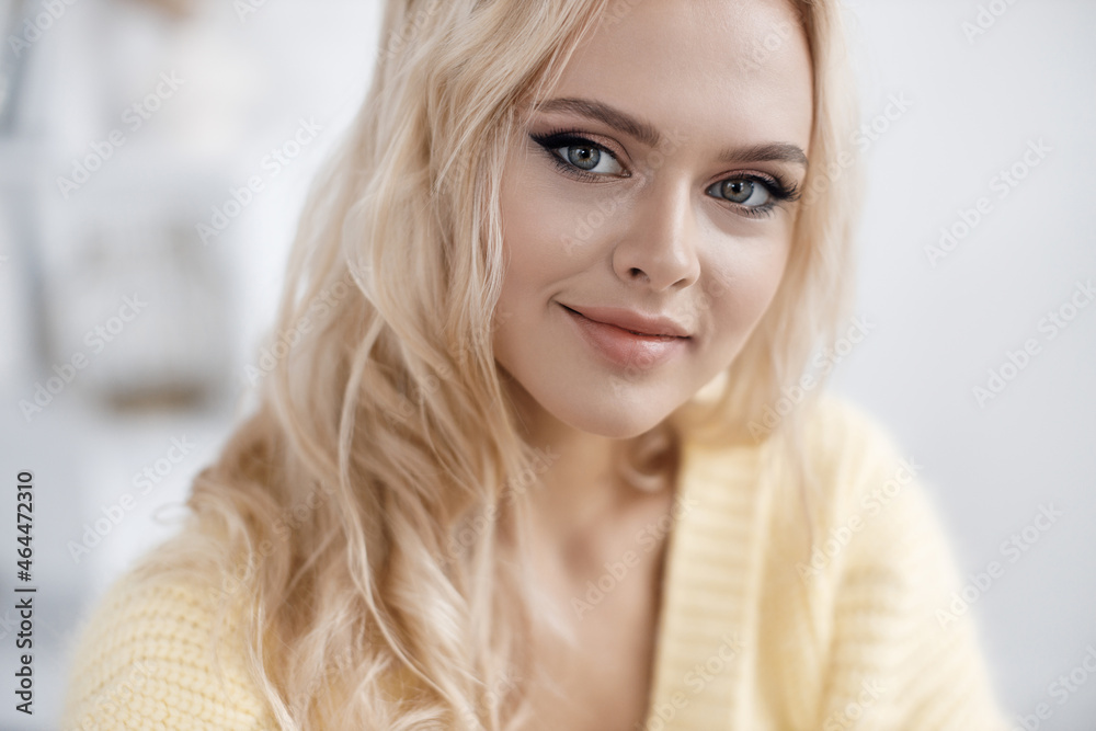 Young beautiful blond woman portrait indoor 