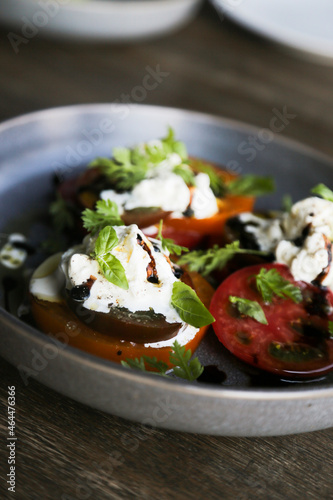 Tomatoes with fresh cheese and balsamic