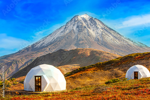White glamping on the slope of a volcano in autumn on the Kamchatka Peninsula. Selective focus photo
