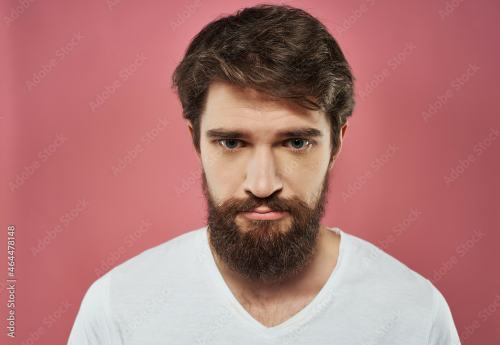 emotional man in a white t-shirt hand gestures anger close-up emotional man in a white t-shirt hand gestures anger close-up