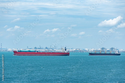 Cargo ships sailing near port of Singapore.