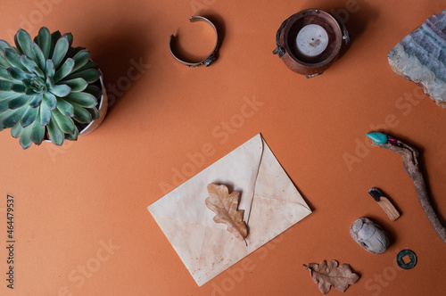 Occult or spiritual backgound with envelope scarab palo santo copy space flat lay photo