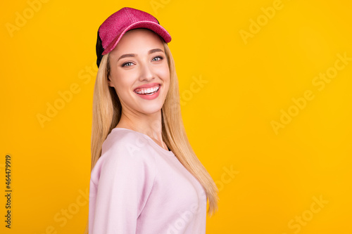 Profile side photo of young attractive girl happy positive smile wear baseball cap isolated over yellow color background