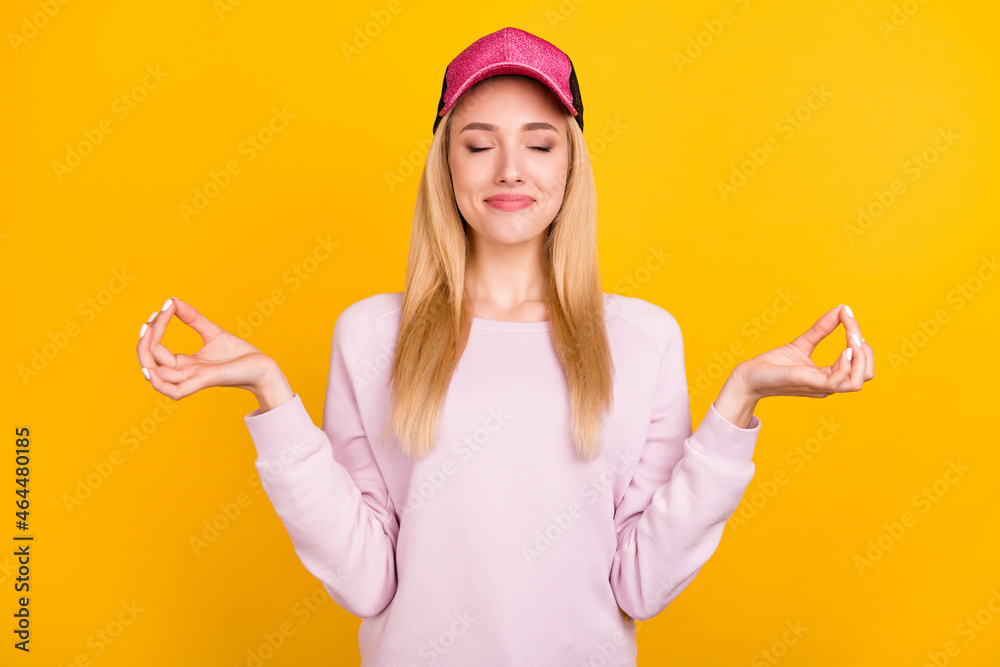 Photo of funny peaceful young lady wear pink sweater headwear smiling practicing yoga isolated yellow color background Photo of funny peaceful young lady wear pink sweater headwear smiling practicing yoga isolated yellow color background