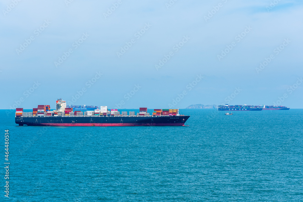 Container ship sailing through the sea. 
