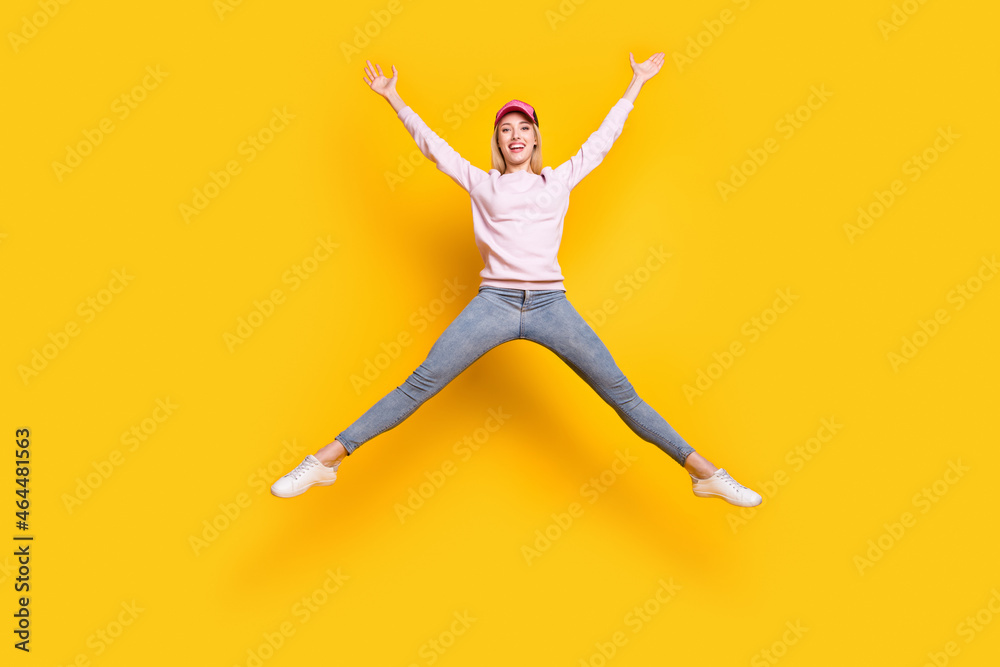 Full length body size photo blonde woman jumping up careless isolated vibrant yellow color background