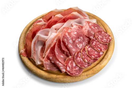 Salami, sausage and Parma ham sliced on wooden cutting board, tasty Italian appetizer isolated on white