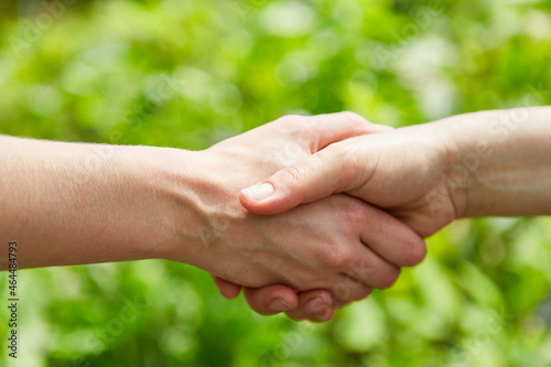 Two people shaking hands or shaking hands © Robert Kneschke
