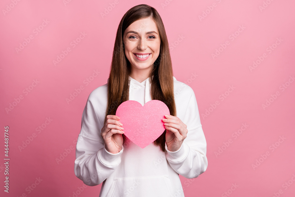 Photo of young girl happy positive smile hold little heart paper love feelings isolated over pastel color background Photo of young girl happy positive smile hold little heart paper love feelings isolated over pastel color background
