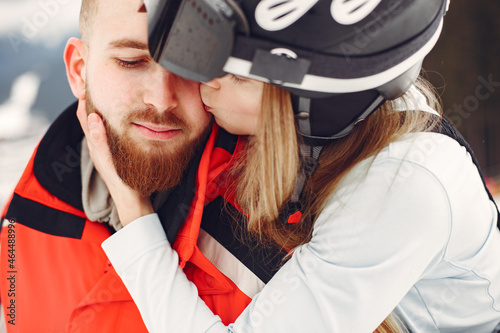 Winter snow couple in a mountains