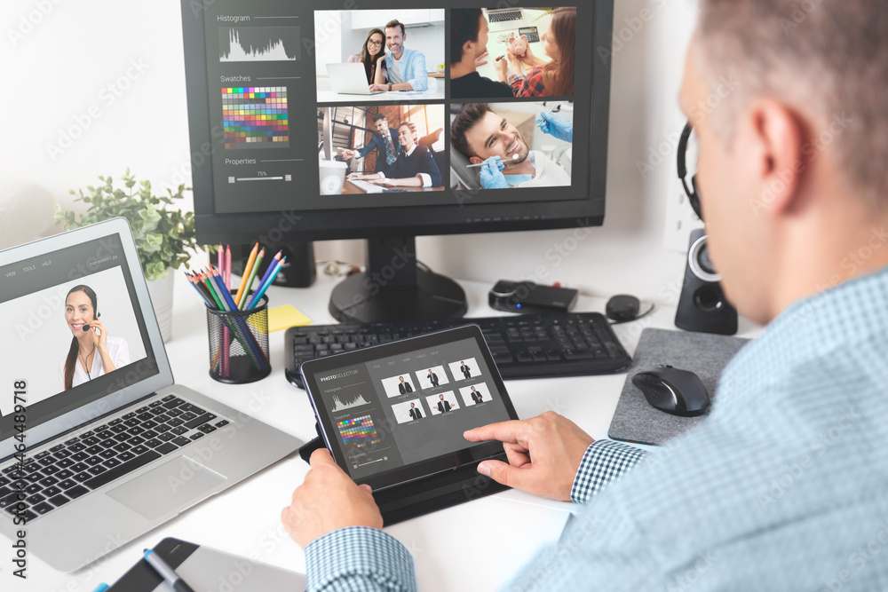 Fototapeta premium Professional photographer working with photos