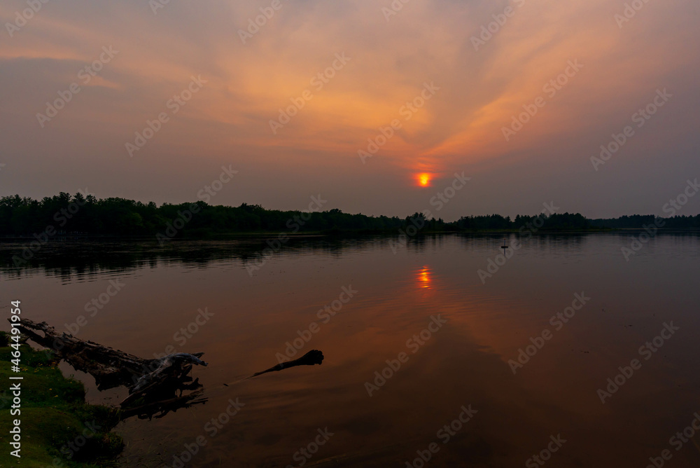 Beautiful sunset on the river bank creating a beautiful natural light. Beautiful sunset on the river bank creating a beautiful natural light.