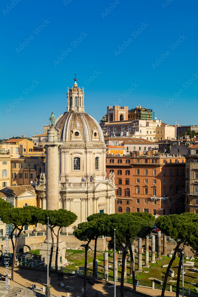 Obraz premium The Church of the Most Holy Name of Mary at the Trajan Forum (Santissimo Nome di Maria al Foro Traiano) and Trajan's Column, as seen from the Altare della Patria, Rome, Italy