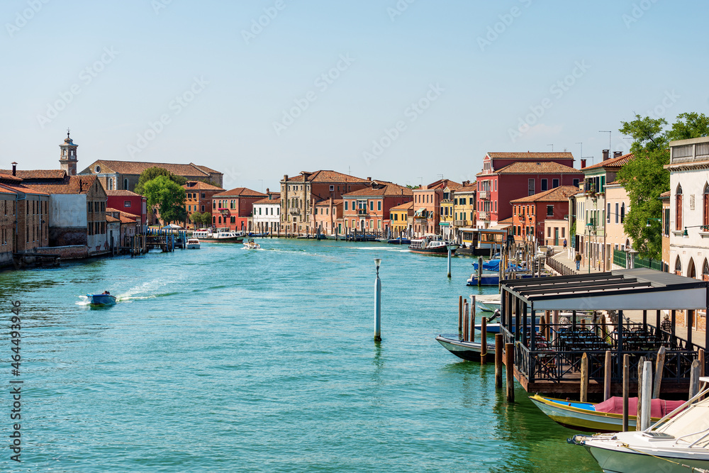 Cityscape of Murano Island, famous for the production of artistic glass. Canal with houses and boats, Venetian lagoon, Venice, UNESCO world heritage site, Veneto, Italy, Europe.