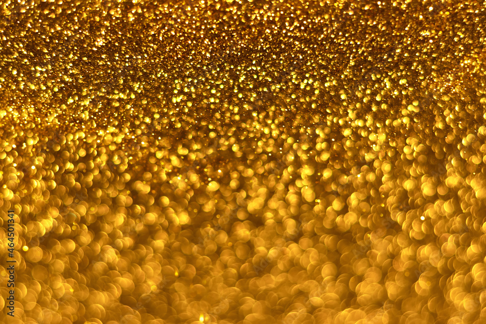 Golden sparkling glitter bokeh background, christmas abstract defocused texture. Holiday lights Golden sparkling glitter bokeh background, christmas abstract defocused texture. Holiday lights