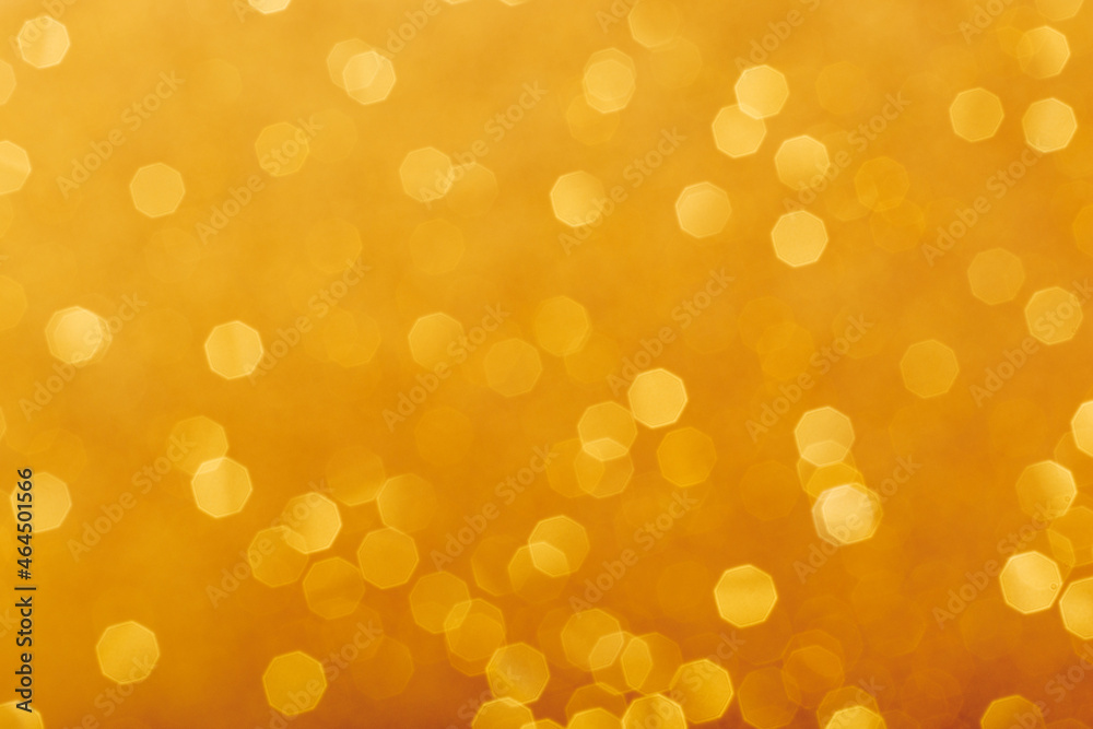 Golden glowing sparkles blurred background Golden glowing sparkles blurred background