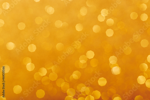 Golden glowing sparkles blurred background