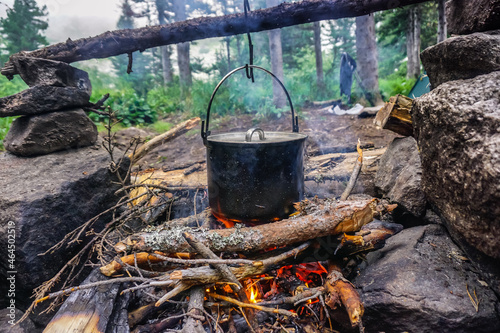 Cooking in a pot over a fire in the taiga