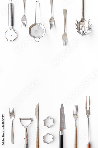 Cooking background with metal kitchen utensils and cookware