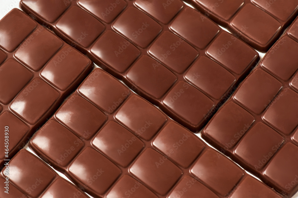 Close up shot of many sweet delicious chocolate bars pattern isolated Close up shot of many sweet delicious chocolate bars pattern isolated
