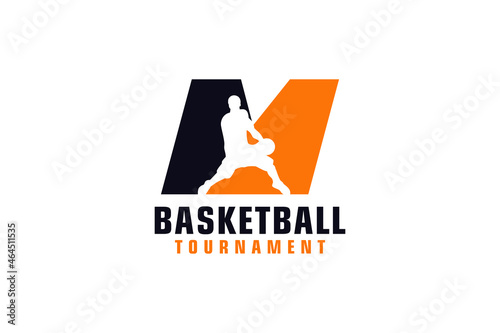Letter M with Basketball Logo Design. Vector Design Template Elements for Sport Team or Corporate Identity.