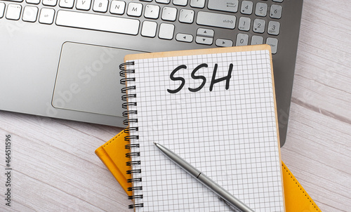 SSH text written on a notebook on the laptop photo