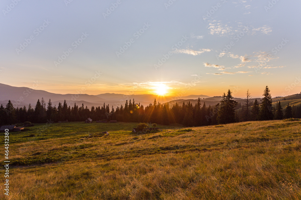 sunset in the mountains. sunbeams. rest on mountain tops