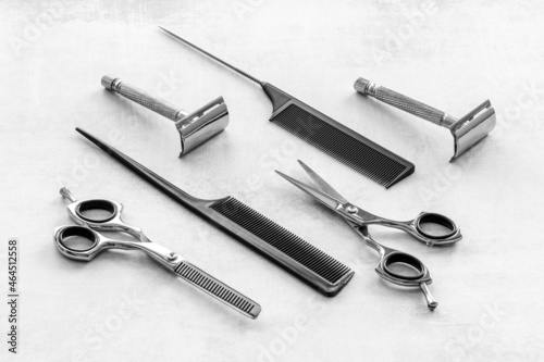 Set of barber shop equipment with hairdressing scissors and combs © 9dreamstudio