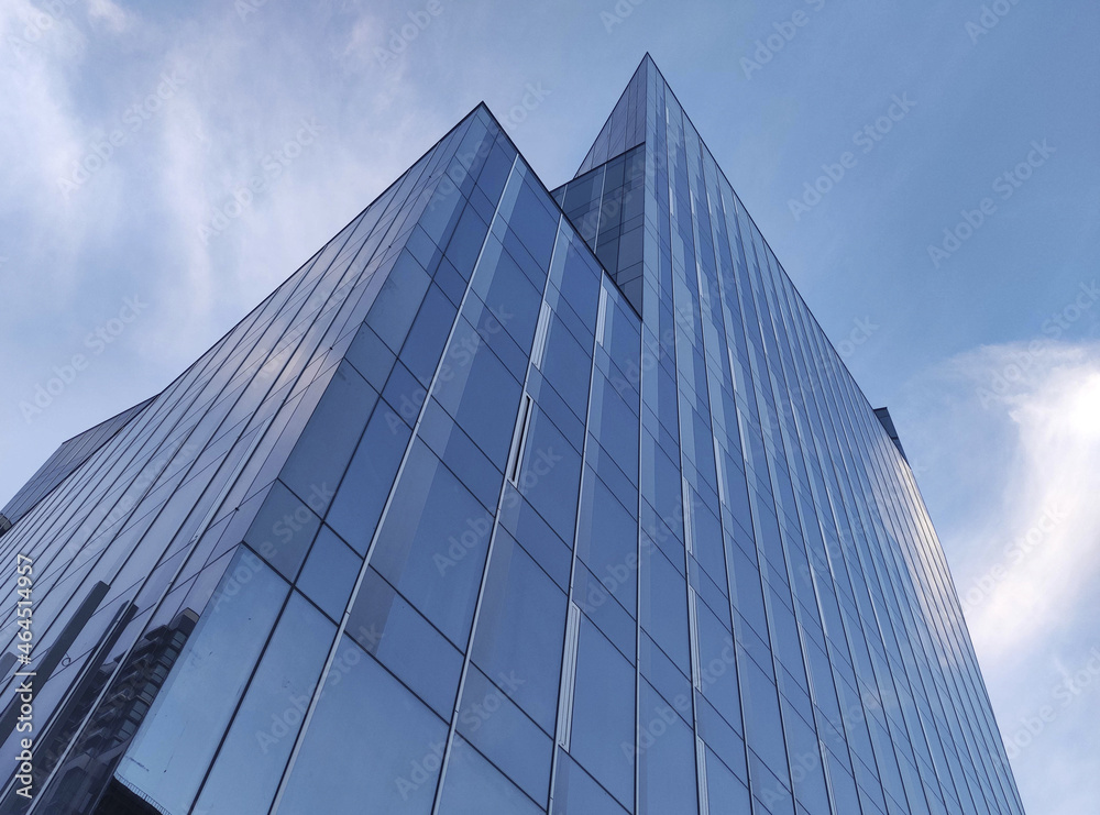 High modern buildings over the blue summer sky background