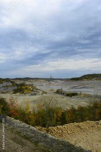 a large limestone quarry on an autumn day
