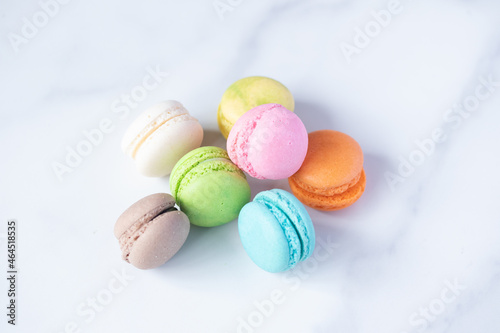 multicolored macarons on marble background
